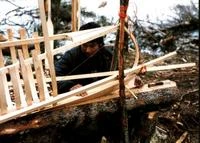Instructor Ispastien Benuen working on canoe at Tshikapisk's Nutshimiu Atusseun Program - Uapinatsheunipit. Photo: Anthony Jenkinson Image
