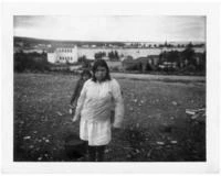 Mary Agnes Asta carrying water. Taken by Pinote Michel. Image